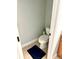 Powder room featuring tile floor, toilet, and muted green walls at 753 Summer Ridge Dr, Villa Rica, GA 30180