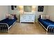 Bedroom area with matching beds, dresser, pink lamps, and wall decor at 753 Summer Ridge Dr, Villa Rica, GA 30180