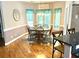 Sunny dining area with hardwood floors and a charming chandelier at 753 Summer Ridge Dr, Villa Rica, GA 30180