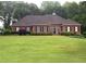 Charming brick home with manicured lawn and black shutters at 753 Summer Ridge Dr, Villa Rica, GA 30180