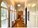 Inviting hallway with hardwood floors and arched windows offering natural light at 753 Summer Ridge Dr, Villa Rica, GA 30180