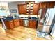 Beautiful kitchen with stainless appliances, wooden cabinets, and a breakfast bar at 753 Summer Ridge Dr, Villa Rica, GA 30180