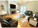Cozy living room with a brick fireplace and hardwood flooring at 753 Summer Ridge Dr, Villa Rica, GA 30180