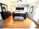 This spacious bedroom offers a trey ceiling, wood floors, neutral walls, and modern furniture at 753 Summer Ridge Dr, Villa Rica, GA 30180