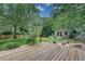 Lush backyard featuring a wooden deck, shed, and garden at 1131 Forrest Blvd, Decatur, GA 30030