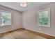 Bedroom featuring natural light from two windows and hardwood floors at 1131 Forrest Blvd, Decatur, GA 30030