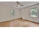 Bright bedroom featuring hardwood floors, neutral paint, and natural light from two windows at 1131 Forrest Blvd, Decatur, GA 30030