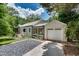 Charming home featuring a detached garage, screened porch, and well-manicured landscaping at 1131 Forrest Blvd, Decatur, GA 30030