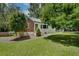 Charming home with a well-manicured lawn, landscaped walkway, and a blend of brick and siding at 1131 Forrest Blvd, Decatur, GA 30030