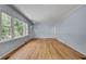 Spacious living room boasts hardwood floors, natural light, and neutral colored walls at 1131 Forrest Blvd, Decatur, GA 30030