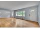 Bright living room featuring hardwood floors, large windows, and neutral paint at 1131 Forrest Blvd, Decatur, GA 30030