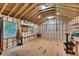 Bright shed interior with plywood flooring, storage shelves, windows, and ample space at 1131 Forrest Blvd, Decatur, GA 30030