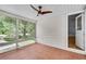 Spacious sunroom with tile flooring, large windows, and a ceiling fan at 1131 Forrest Blvd, Decatur, GA 30030