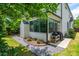Spacious backyard featuring a stone pathway, lush greenery, a barbecue, and outdoor seating at 174 Pearl Se St, Atlanta, GA 30316