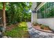 Well-maintained backyard with green grass, gravel pathway, and lush landscaping at 174 Pearl Se St, Atlanta, GA 30316