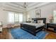Bedroom features a tray ceiling, chandelier, neutral colors and plenty of natural light at 174 Pearl Se St, Atlanta, GA 30316