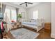 Well-lit bedroom features decor, a daybed and an abundance of toys at 174 Pearl Se St, Atlanta, GA 30316