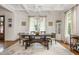 Formal dining room featuring a large wooden table with seating for six and ample natural light at 174 Pearl Se St, Atlanta, GA 30316