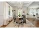 Beautiful dining area featuring a large wooden table, chandelier, and coffered ceilings at 174 Pearl Se St, Atlanta, GA 30316