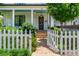 Inviting home entrance with brick walkway, tidy landscaping, and a decorative wreath on the front door at 174 Pearl Se St, Atlanta, GA 30316