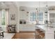 Bright kitchen features white cabinetry, hardwood floors, stainless appliances, and a rolling bar cart at 174 Pearl Se St, Atlanta, GA 30316