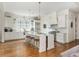 Spacious kitchen with modern appliances, an island with seating, and hardwood floors at 174 Pearl Se St, Atlanta, GA 30316
