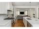 Bright kitchen features stainless steel appliances, an island with a sink, and an open concept layout at 174 Pearl Se St, Atlanta, GA 30316