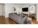 Spacious living room features a comfortable gray sectional sofa and entertainment center at 174 Pearl Se St, Atlanta, GA 30316