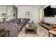 Spacious living room features a comfortable gray sectional sofa, rug, and entertainment center at 174 Pearl Se St, Atlanta, GA 30316