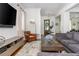 Spacious living room features a comfortable gray sectional sofa and entertainment center at 174 Pearl Se St, Atlanta, GA 30316