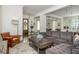 Bright open-concept features a modern kitchen, dining space, and living room with sectional sofa at 174 Pearl Se St, Atlanta, GA 30316