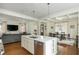Bright open-concept features a modern kitchen, dining space, and living room with a large island at 174 Pearl Se St, Atlanta, GA 30316