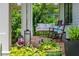Cozy porch with a swing, rocking chairs, and potted plants, perfect for relaxation at 174 Pearl Se St, Atlanta, GA 30316