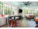 Inviting sunroom features a bar area, fireplace, and comfortable seating, creating a perfect relaxation space at 174 Pearl Se St, Atlanta, GA 30316