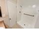 Bathroom showcasing a walk-in shower with white tile and a safety bar at 3301 Henderson Mill Rd # 1, Atlanta, GA 30341