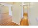 Bright hallway featuring hardwood floors and neutral colors. It includes a closet and leads to another room at 3301 Henderson Mill Rd # 1, Atlanta, GA 30341