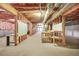 Large unfinished basement providing a blank canvas for renovation and storage with exposed framework at 3358 Lake Dr, Lawrenceville, GA 30044