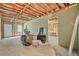 Unfinished basement with exposed ceiling, concrete floors, and doorway to adjacent room. Ready to be finished to your liking at 3358 Lake Dr, Lawrenceville, GA 30044