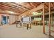 Unfinished basement offering potential for customization with exposed beams and ample open space at 3358 Lake Dr, Lawrenceville, GA 30044