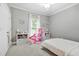 Charming bedroom with grey walls, neutral carpet and bright window light at 3358 Lake Dr, Lawrenceville, GA 30044