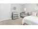 Cozy bedroom with gray changing table, crib, mirror and bed in a neutral color palette at 3358 Lake Dr, Lawrenceville, GA 30044