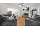 Cozy living room with hardwood floors, a marble fireplace, and comfortable seating at 3358 Lake Dr, Lawrenceville, GA 30044
