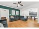 Spacious living room featuring modern decor, hardwood floors, and access to dining area at 3358 Lake Dr, Lawrenceville, GA 30044