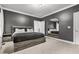 Lovely bedroom with grey walls, neutral carpet, large windows, ensuite bathroom, and a cozy atmosphere at 3358 Lake Dr, Lawrenceville, GA 30044