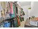 Functional walk-in closet features built-in shelving, and hanging racks for an organized wardrobe at 3358 Lake Dr, Lawrenceville, GA 30044