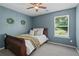 Cozy bedroom with a full bed, plush pillows, and a soft throw blanket at 4020 New Salem Ct, Cumming, GA 30040