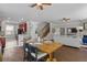 Open layout featuring a dining area, kitchen with bar seating, and a cozy living room with ample natural light at 4020 New Salem Ct, Cumming, GA 30040