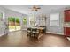 Bright dining space featuring hardwood floors and sliding door access to a backyard with manicured lawn at 4020 New Salem Ct, Cumming, GA 30040