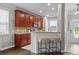 Modern kitchen with stylish bar stools, granite countertops, stainless steel appliances, and ample cabinet space at 4020 New Salem Ct, Cumming, GA 30040