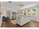 Bright living room featuring a fireplace, hardwood floors, and large windows providing ample natural light at 4020 New Salem Ct, Cumming, GA 30040